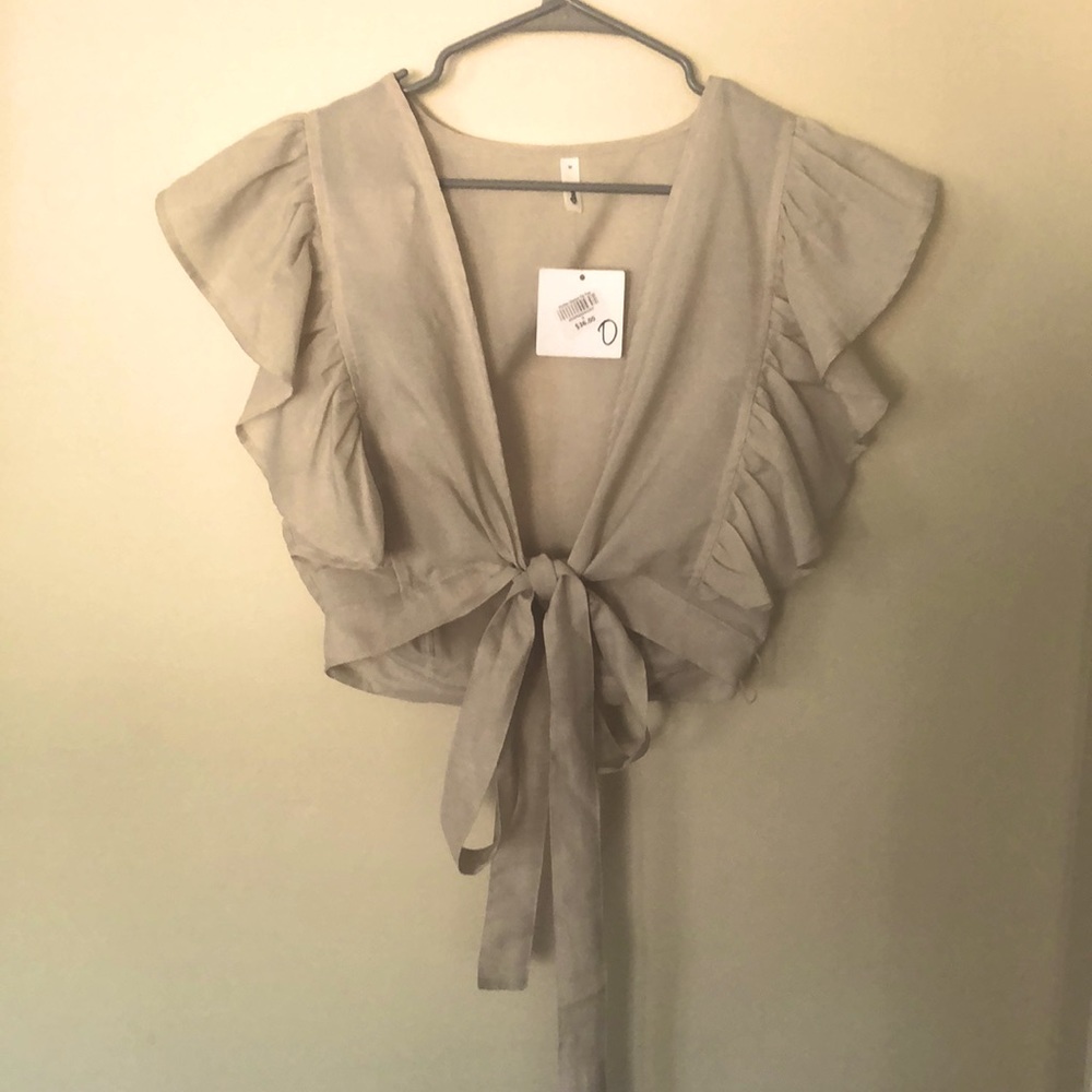 Tan/cream flutter sleeve tie top. Size M. Bought from boutique for $36.